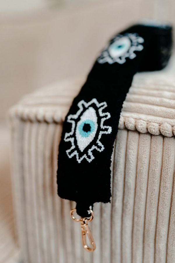 bandoulière brodée à la main de couleur noire avec un motif oeil