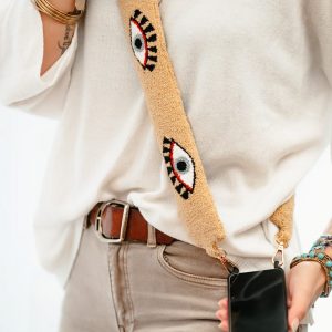 Bandoulière de coque de téléphone brodée à la main de couleur beige avec un motif oeil
